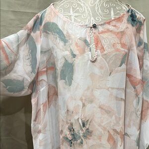 Jennifer Lopez Sheer Blouse with Earthy Tones